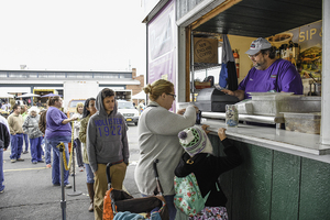 Customers line up to get a taste of Regional Donut Authority's famous apple cider doughnuts. 